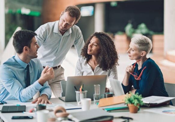 Multi-ethnic group of entrepreneurs discussing business Multi-ethnic group of entrepreneurs discussing business